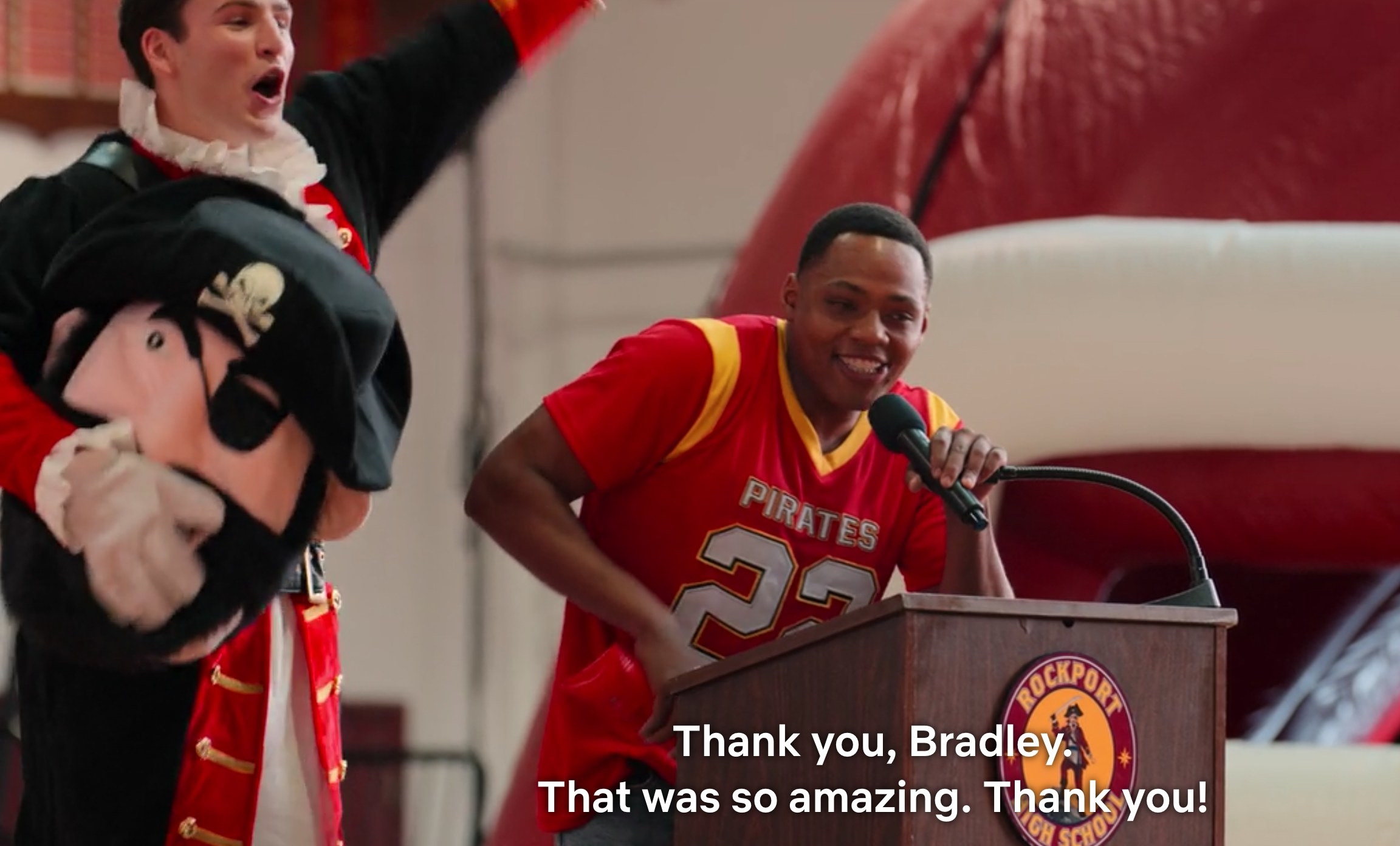 Bradley, a student who is also the pirate mascot, stands next to an athlete who says, &quot;Thank you, Bradley. That was so amazing; thank you!&quot;