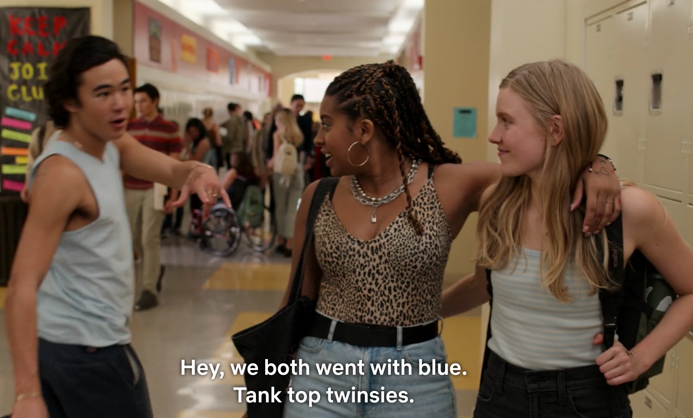 High school girls with arms around each other say to Seth, &quot;Hey, we both went with blue; tank top twinsies&quot;