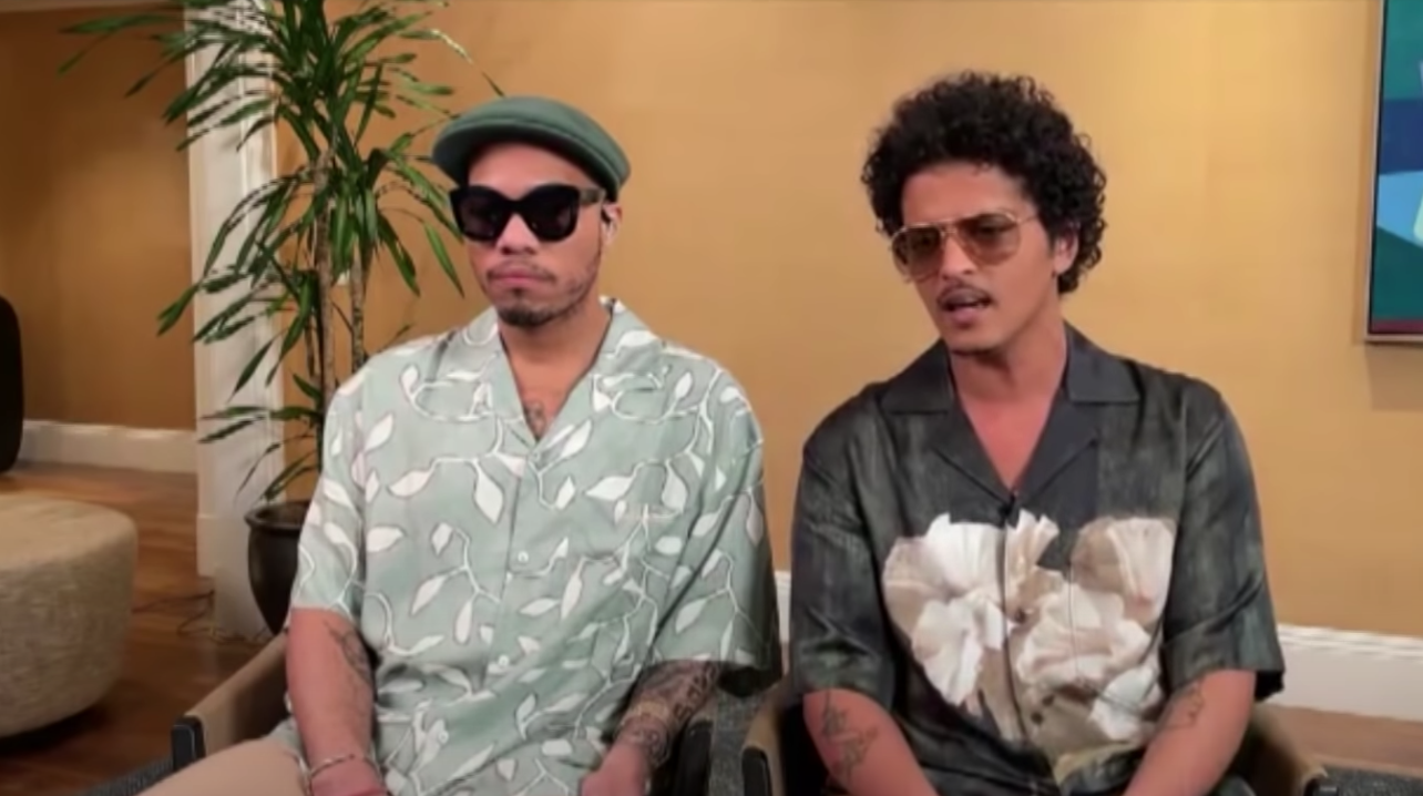 Anderson and Bruno sitting next to each other during an interview