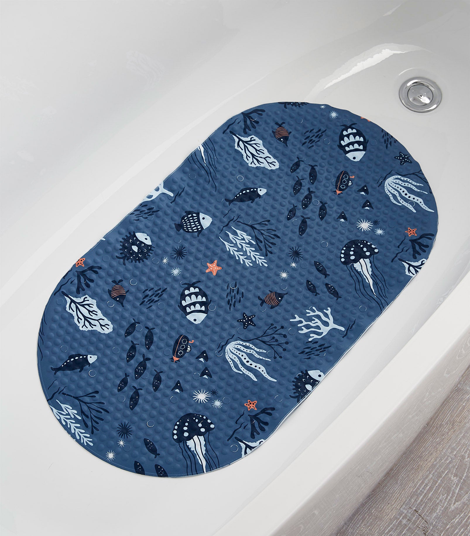 A bath mat stuck to the bottom of a bathtub