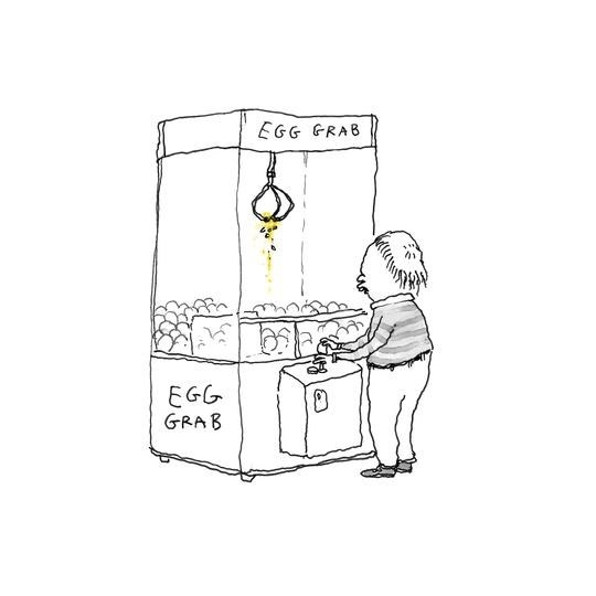 Someone operating a claw machine that says &quot;Egg Grab&quot; and is filled with eggs
