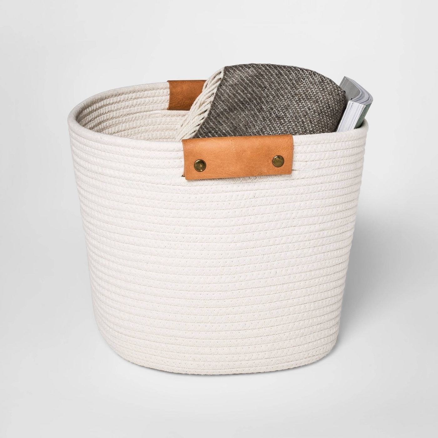 Cream basket with brown leather handles