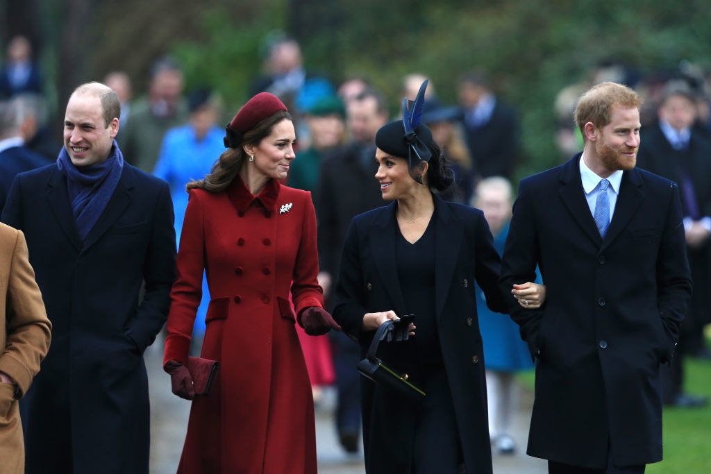 William, Kate, Meghan, and Harry walking together during the Christmas holidays