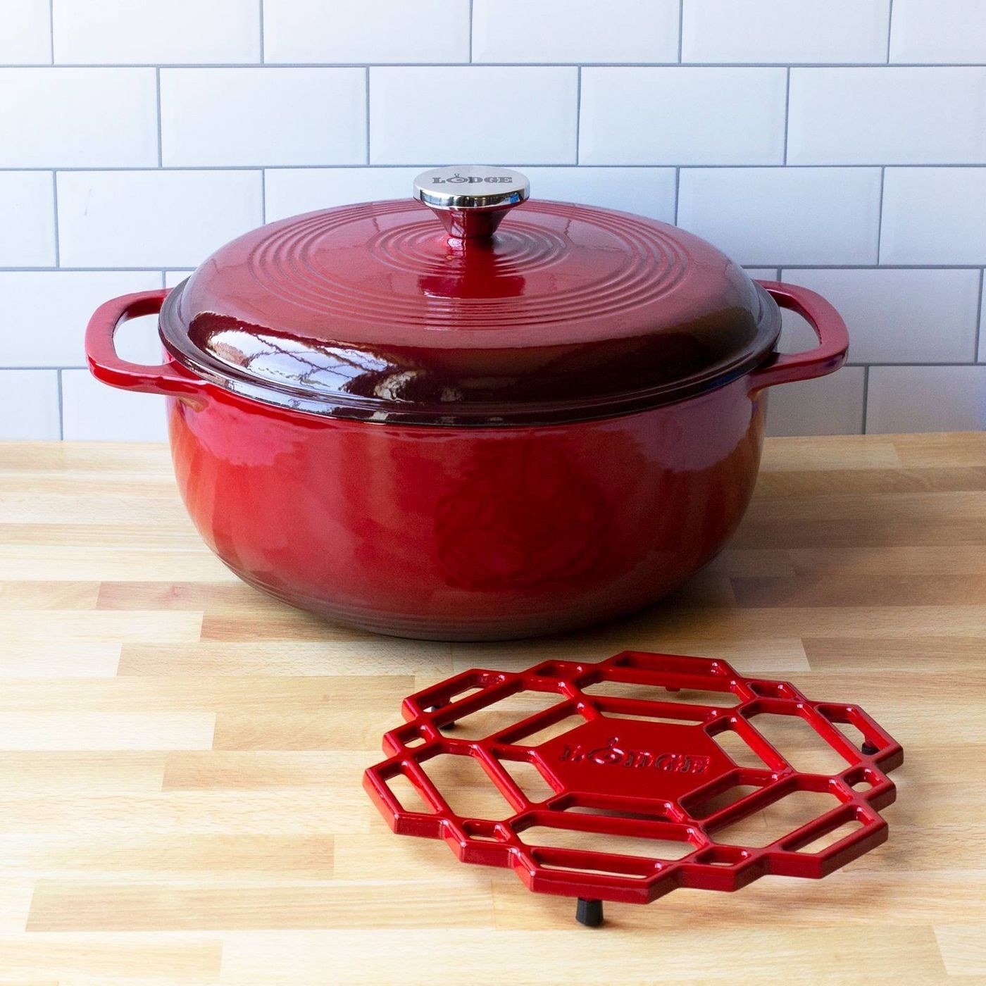 red dutch oven with stainless steel handle