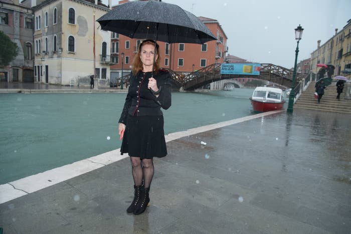 Sarah Ferguson, holding an umbrella, in Venice in 2019