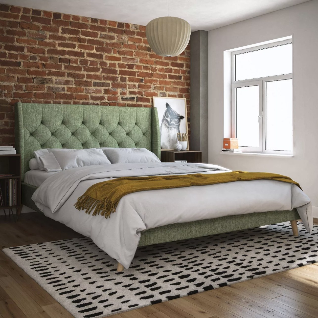 Upholstered bed in bedroom. 