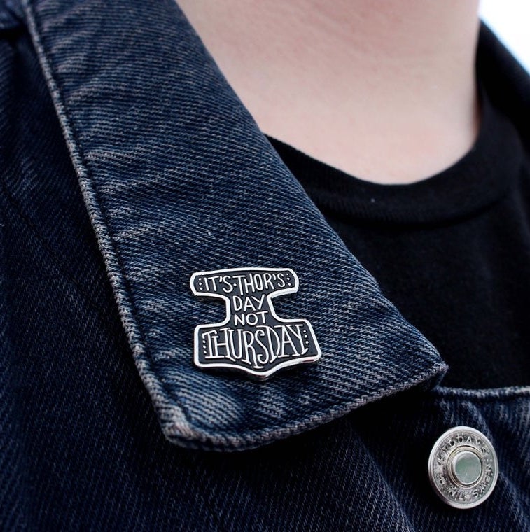 The pin on the lapel of a jean jacket