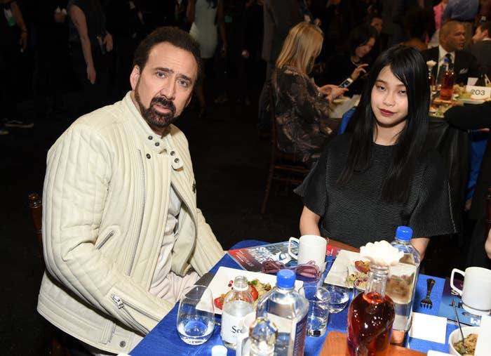Nicolas Cage and Riko Shibata sitting at a table and eating at the 2020 Film Independent Spirit Awards