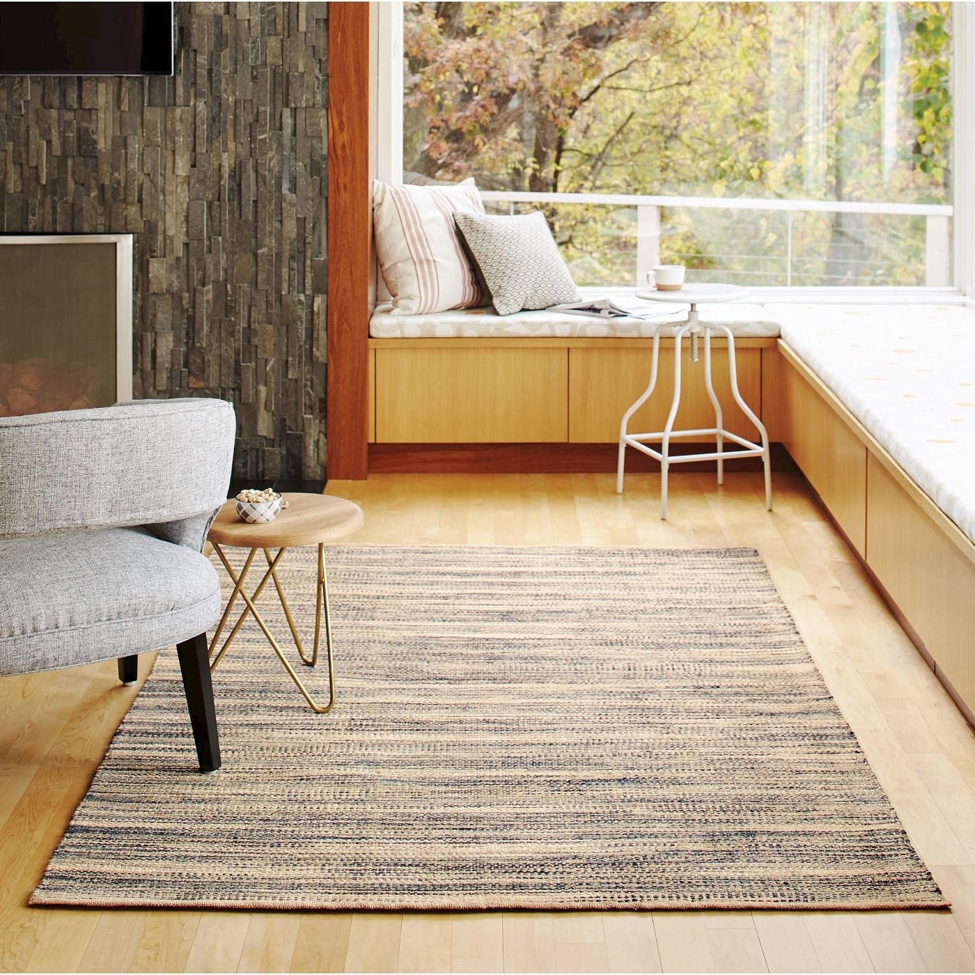 grey rectangular woven rug on hardwood floor