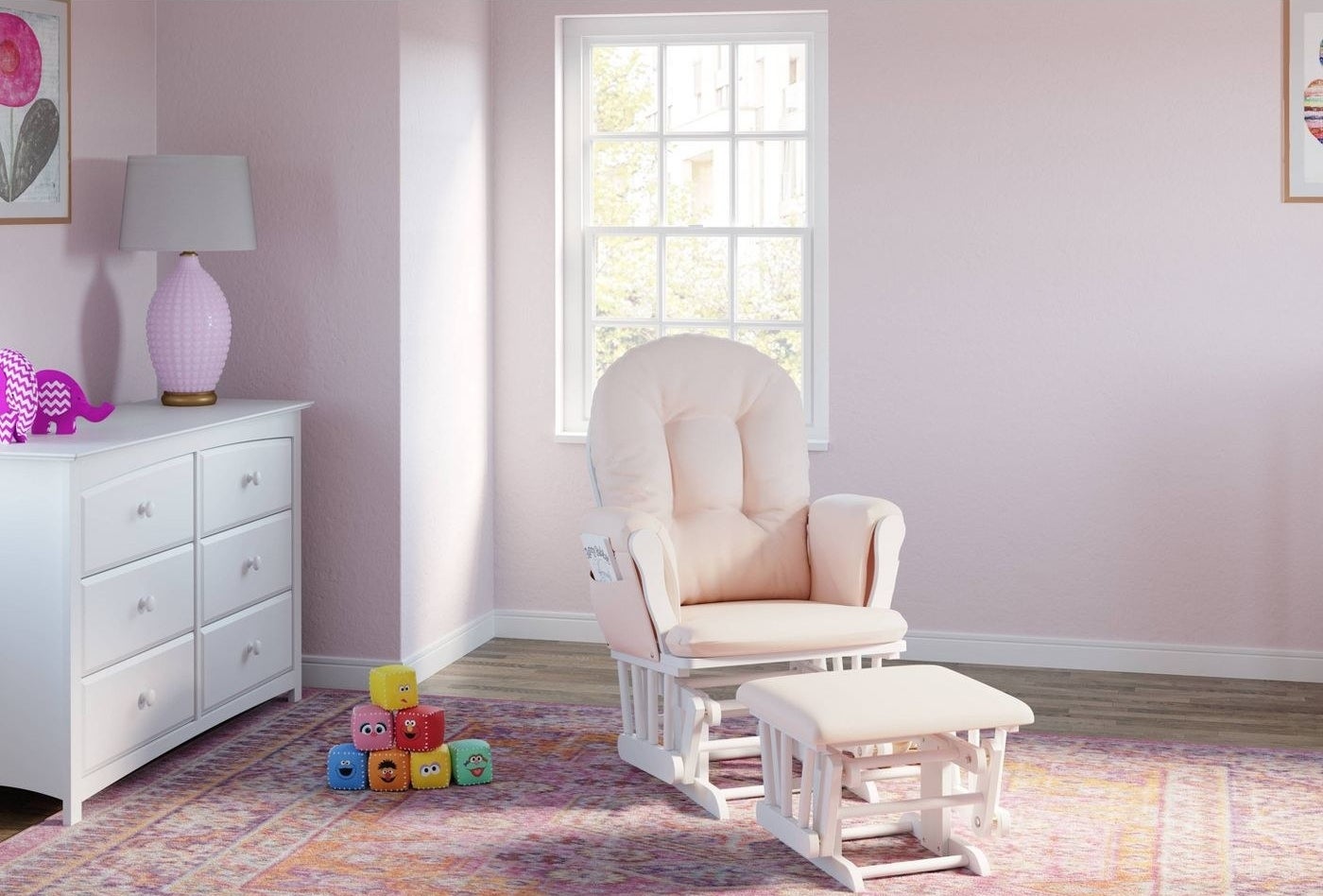 Pink and white glider in a light pink nursery