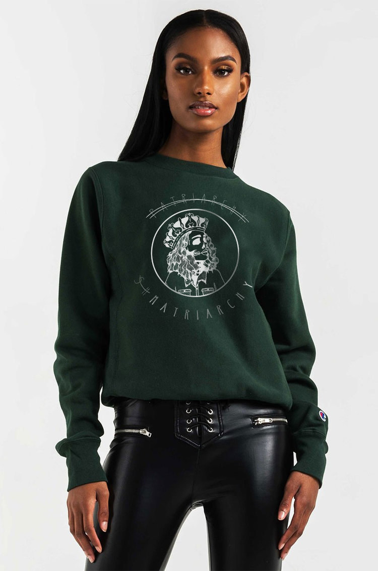 a model wearing the forest green sweatshirt that says &quot;Patriarchy Shmatriarchy&quot;