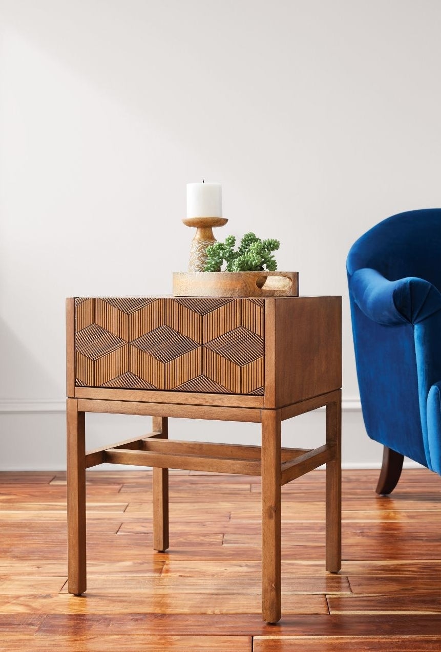 wood accent table with geometric pattern on the front