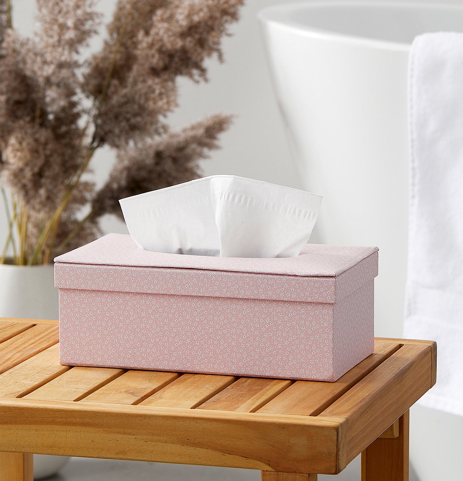 A tissue box on a wooden stool