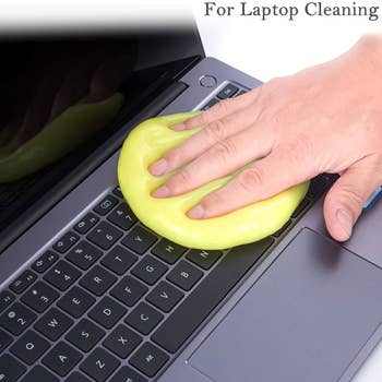 Hand pressing the gel on a keyboard