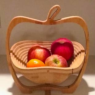 The same tray popped out and turned into a bowl with an apple shape 