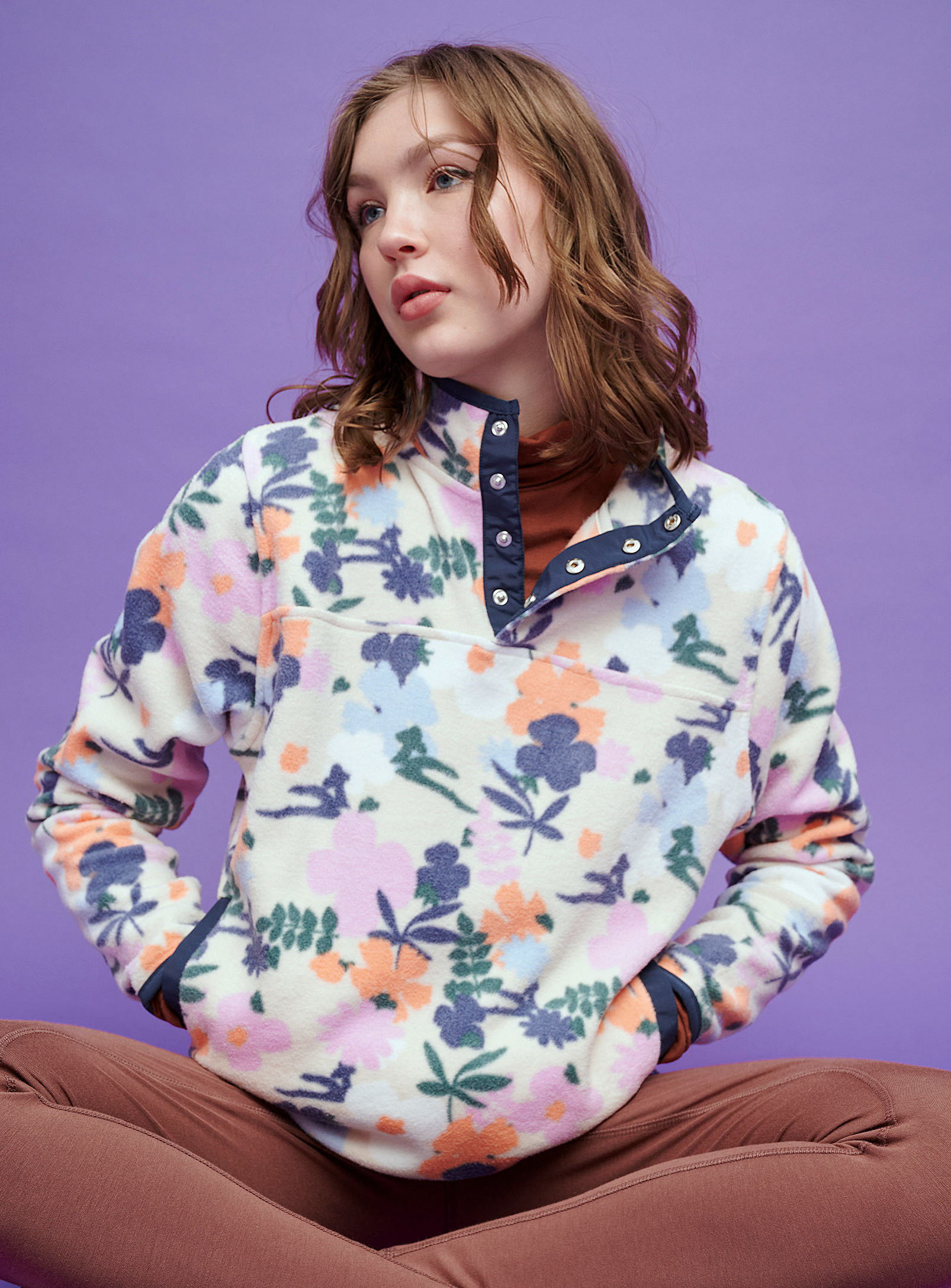 A person wearing the floral fleece