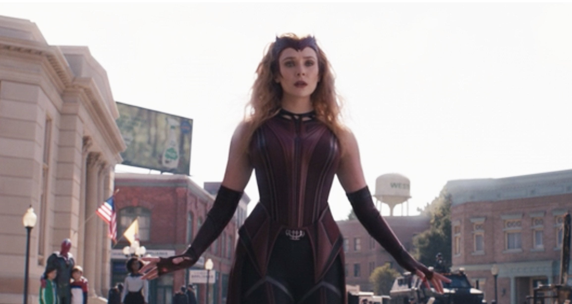 Wanda wears a maroon, blue, and gray uniform