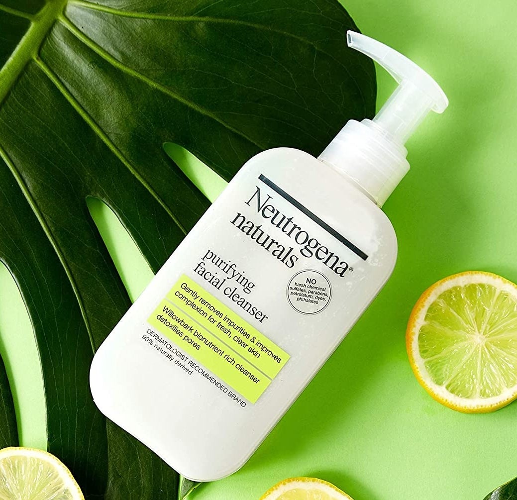 An image of the facial cleanser bottle surrounded by refreshing lemons.
