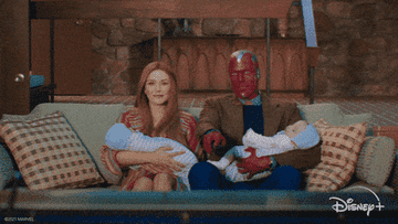 Wanda and Vision on the couch with their twin babies