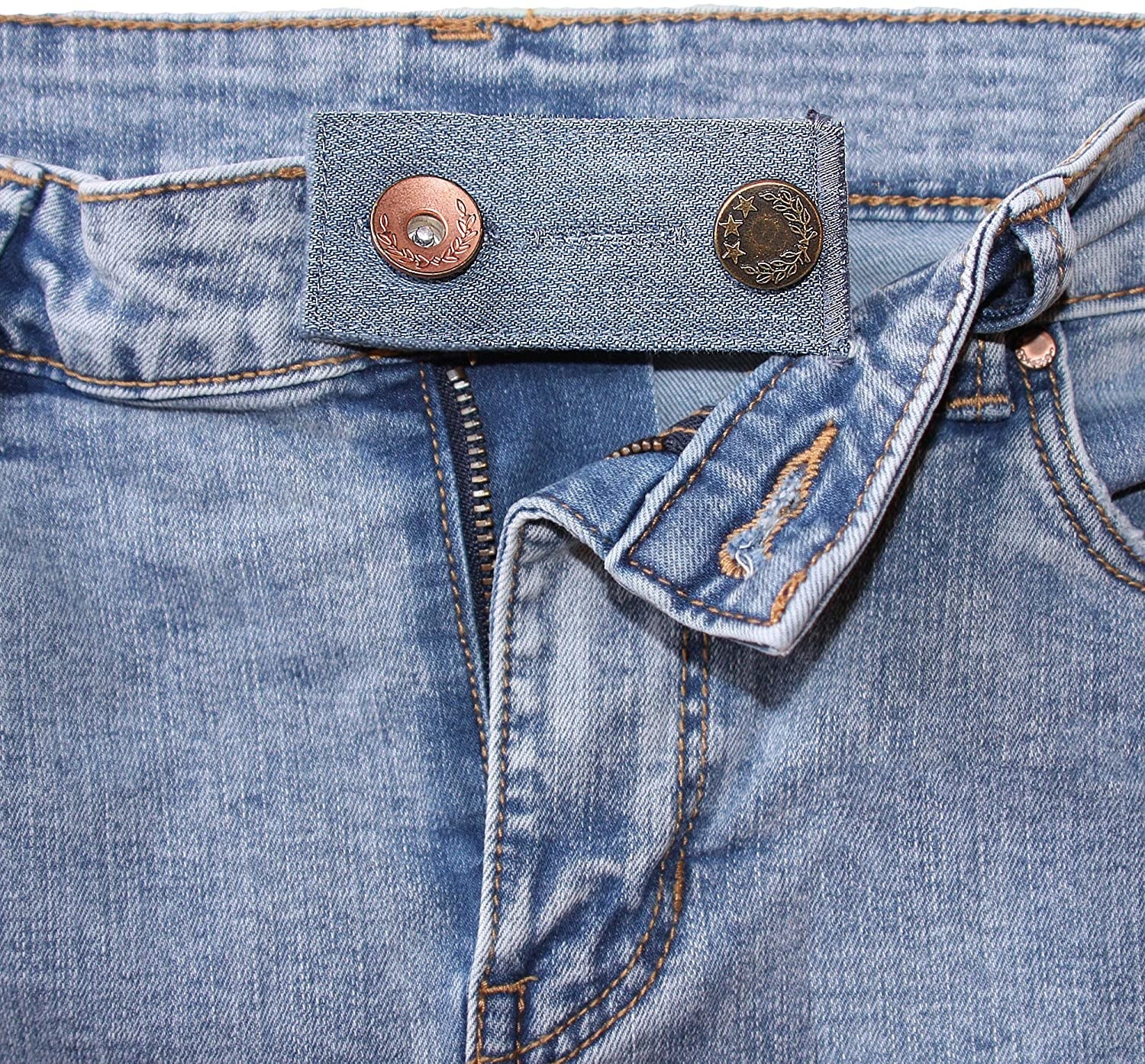 the button extender providing an extra inch of waistline to a pair of jeans