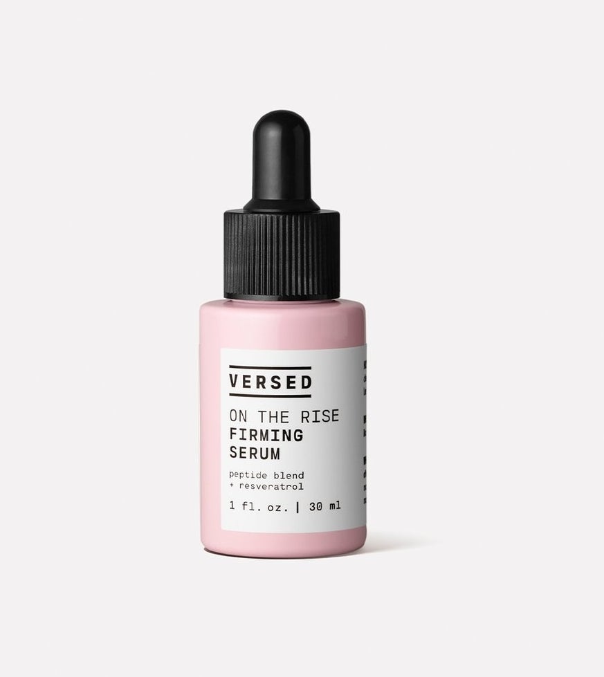 small pink bottle of firming serum