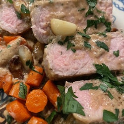 Cooked garlic pork chops with side of carrots 
