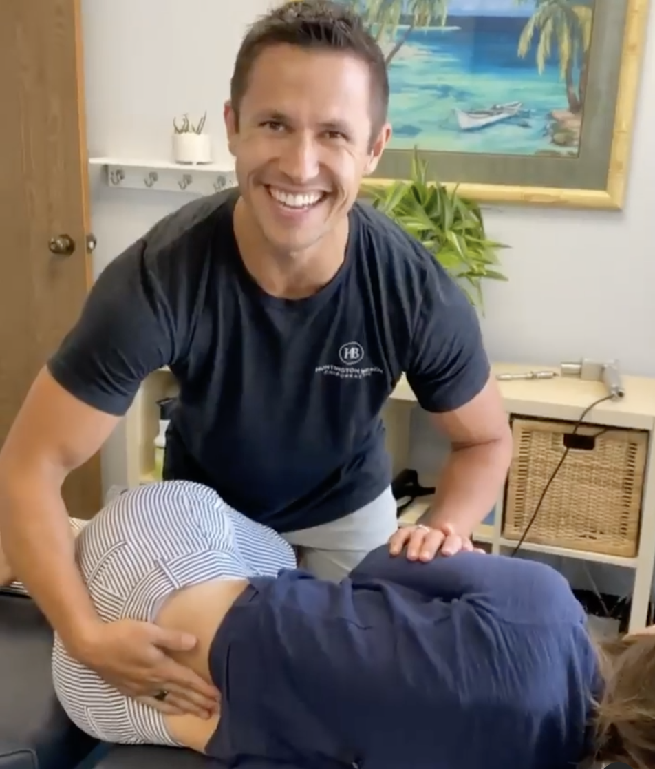 A chiropractor working on a patient