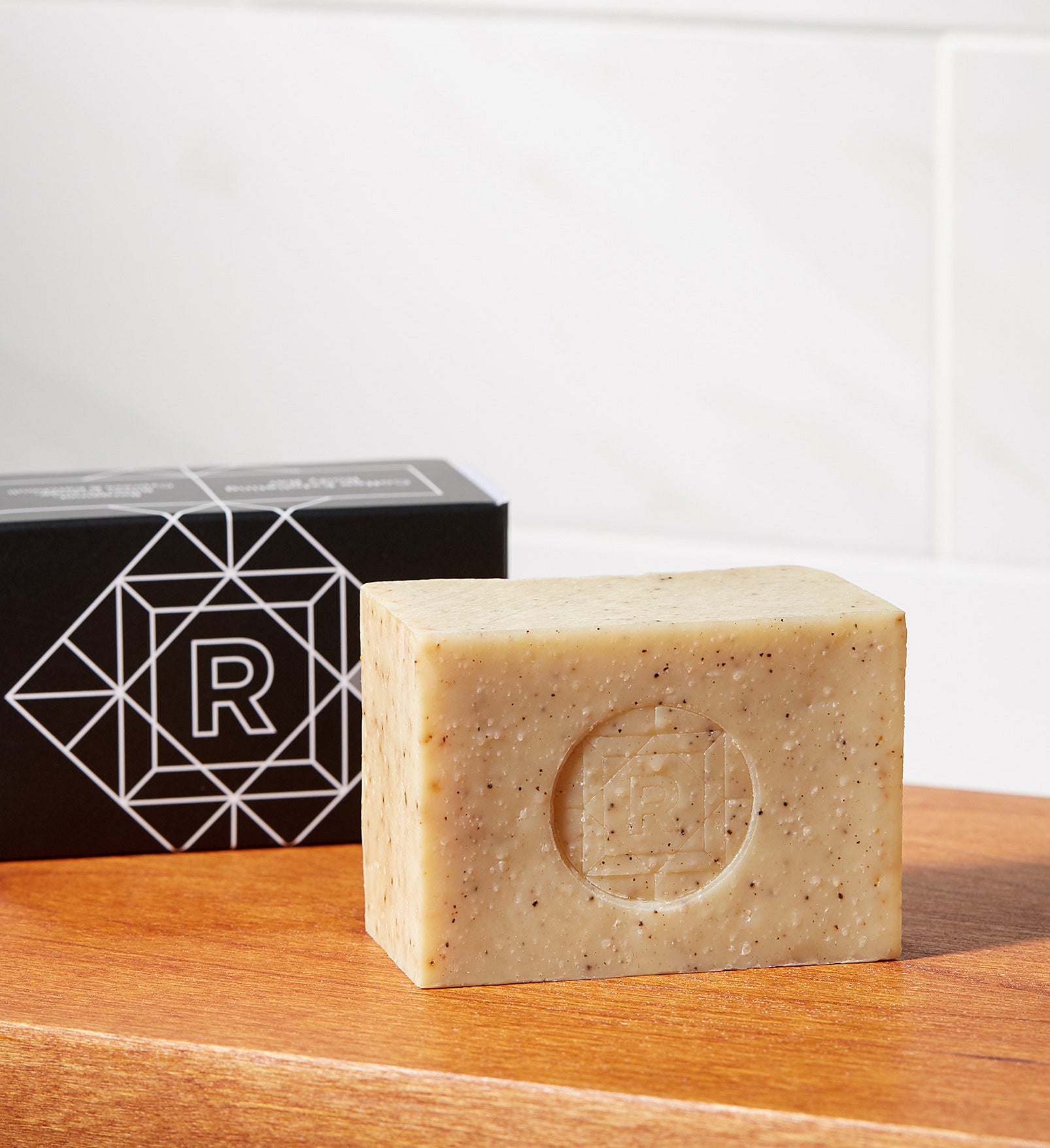 A bar of coffee-infused soap on a counter