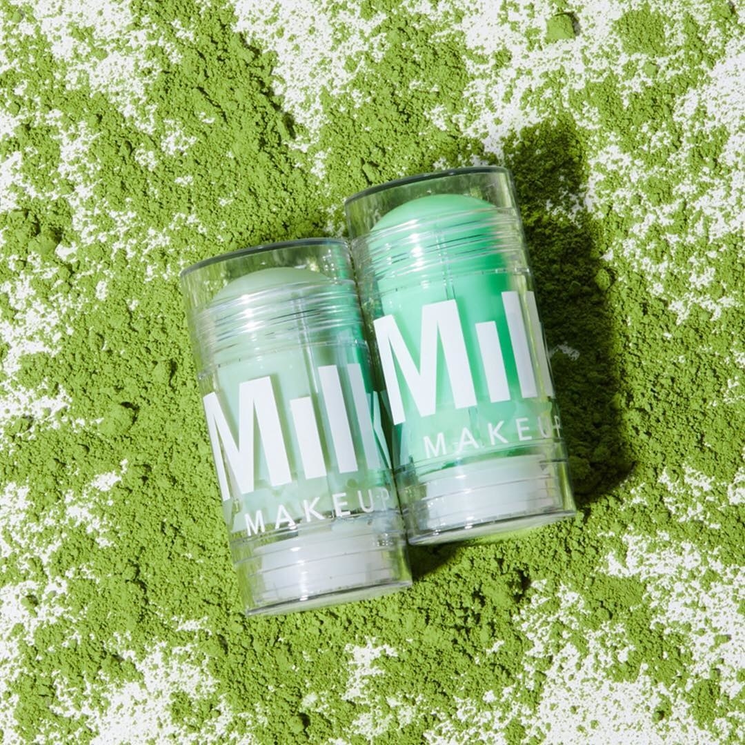 The solid cleanser and toner laid on a bed of matcha powder