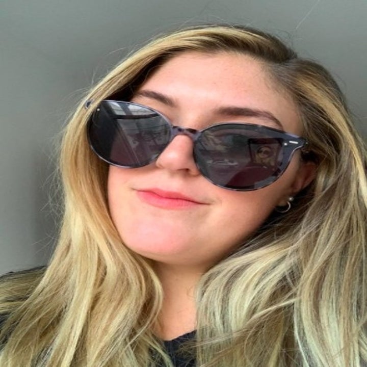 person wearing a pair of black sunglasses