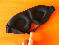 back of same sleep mask with contoured cups that cradle eyes