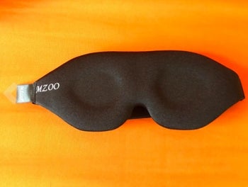front of a sleep mask that blocks out light