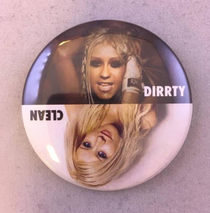 A round magnet with Christina aguilera&#x27;s picture from her &quot;dirrty&quot; music video on one side with the word &quot;dirrty&quot; and her picture on the opposite side (so you can read it when when rotated) with a more innocent look that says &quot;clean&quot; 