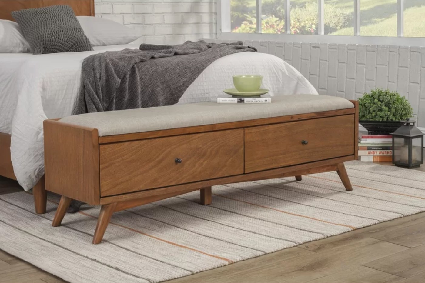 The upholstered drawer storage bench in acorn