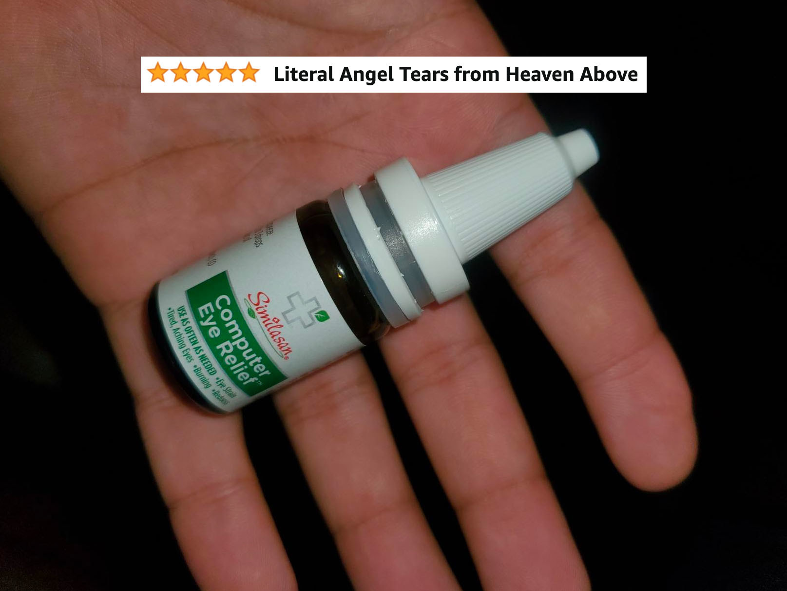 reviewer image of similasan computer eye relief drop bottle in the palm of a hand with text overlaid reading &quot;literal angel tears from heaven above&quot;