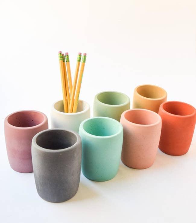 Eight concrete mugs in different colors