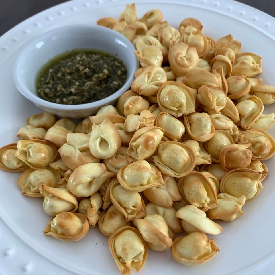 Air fryer tortellini with pesto on the side.