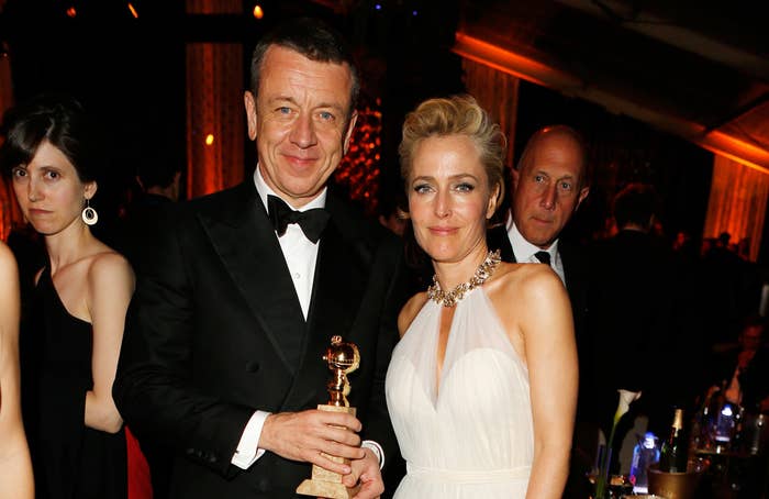 Peter stands with The Crown star Gillian Anderson