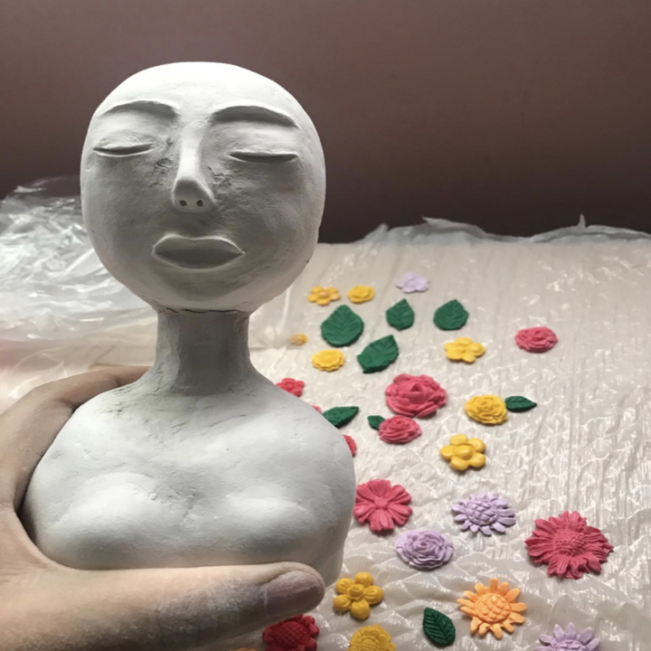 reviewer photo of the clay being molded into a person