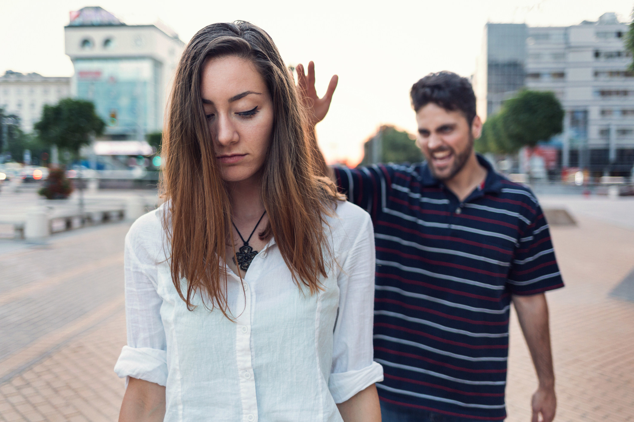 a woman being harassed on the street by a shouting man
