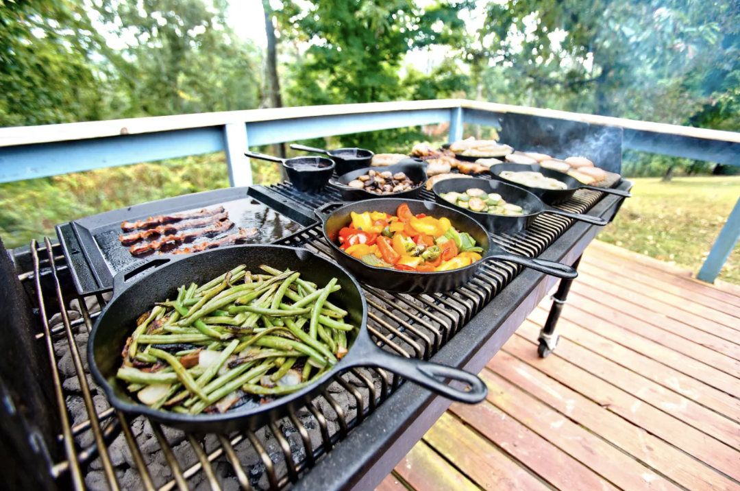 cast iron skillets on a grill