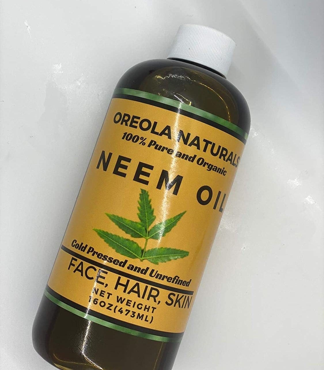 A bottle of organic cold pressed and unrefined neem oil