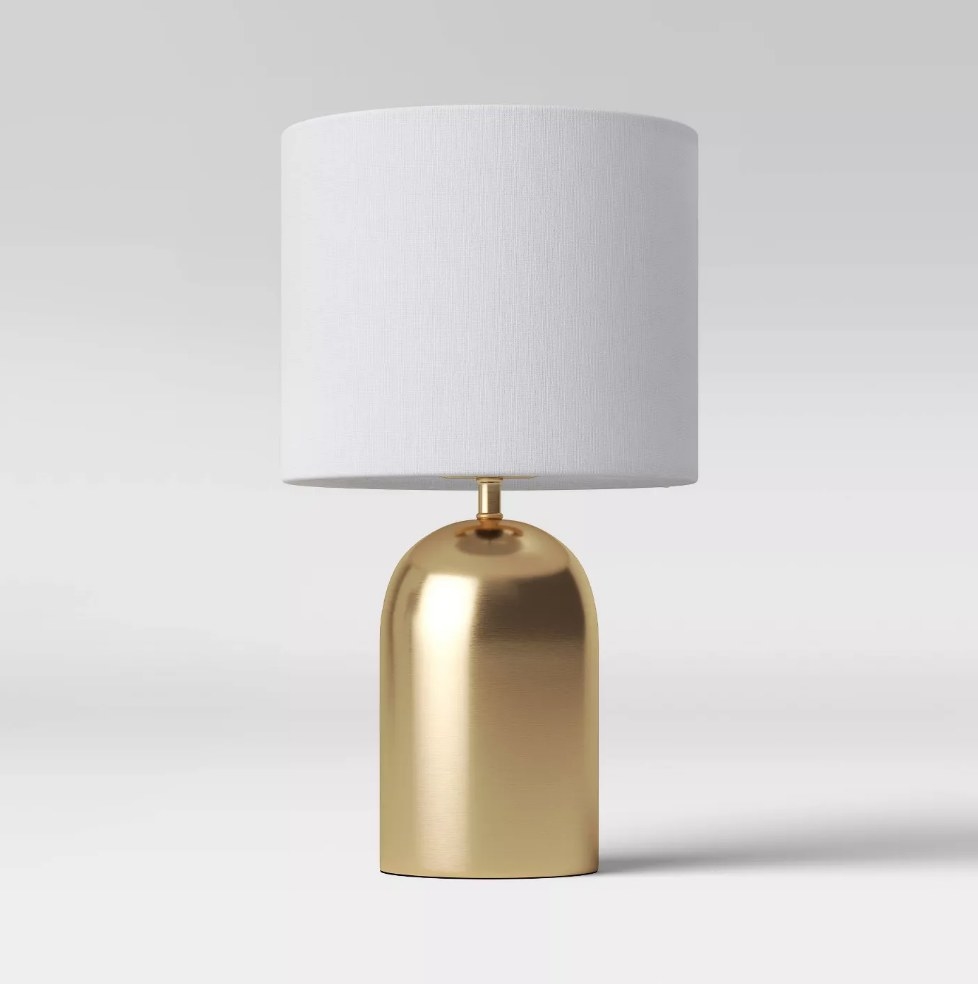Gold table lamp with white shade