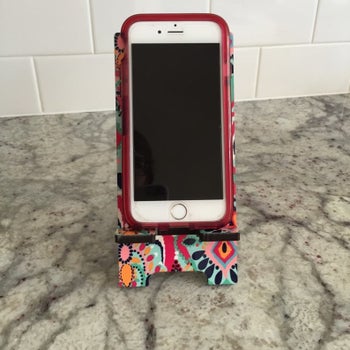 iPhone placed on customized phone stand