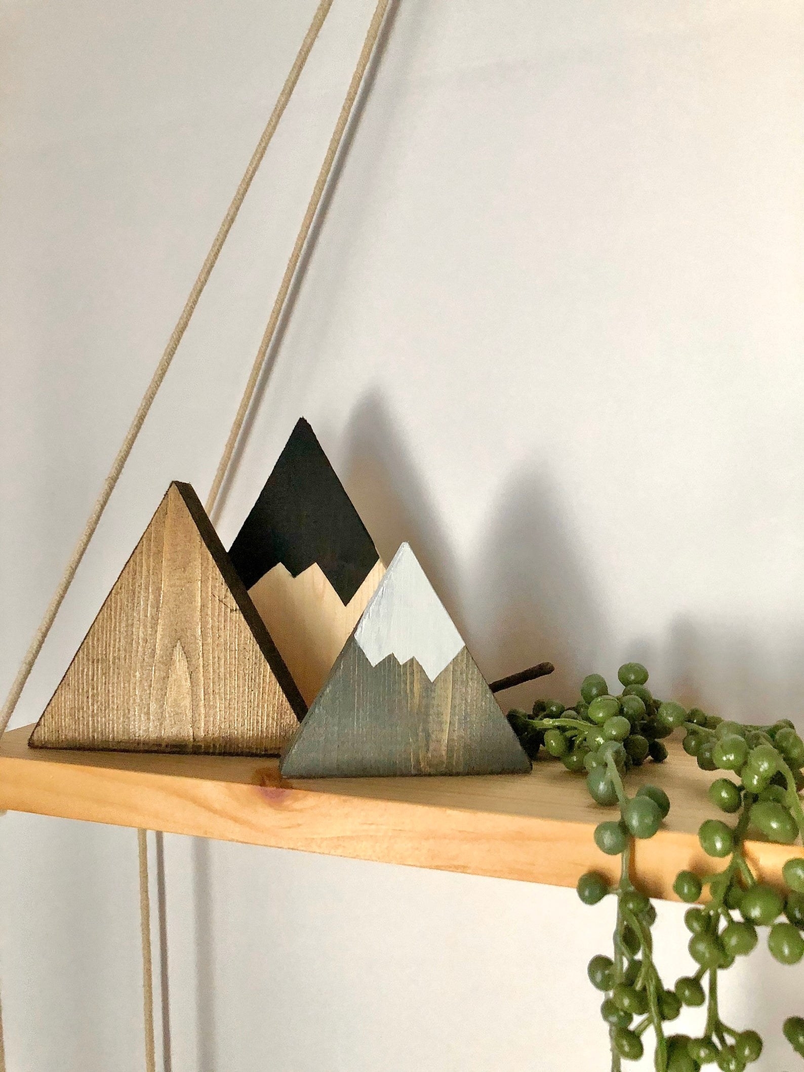 small wooden mountains on a shelf