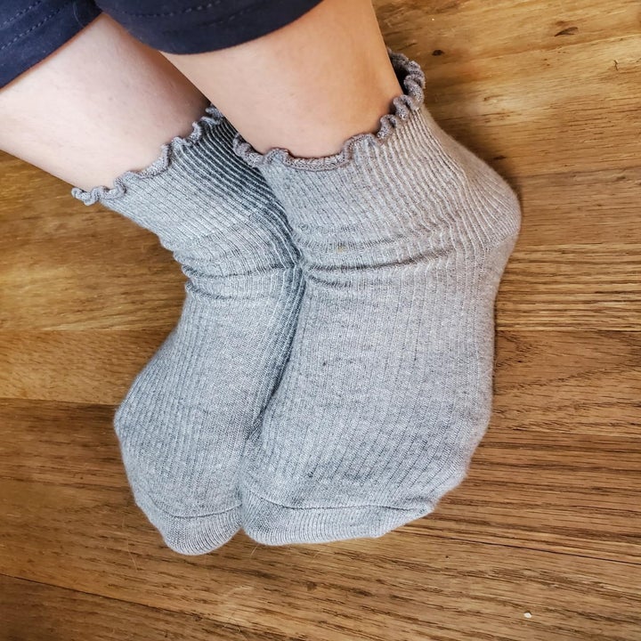 The socks in gray worn by an Amazon reviewer