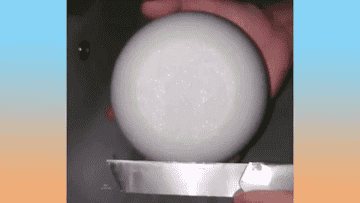 Bath bomb being scraped by knife GIF