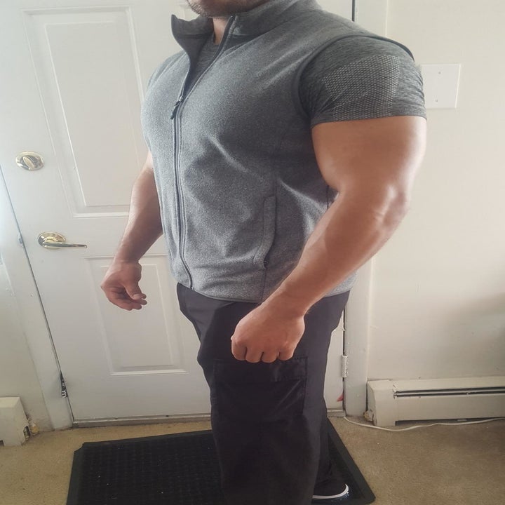 reviewer wearing the fleece vest in grey 