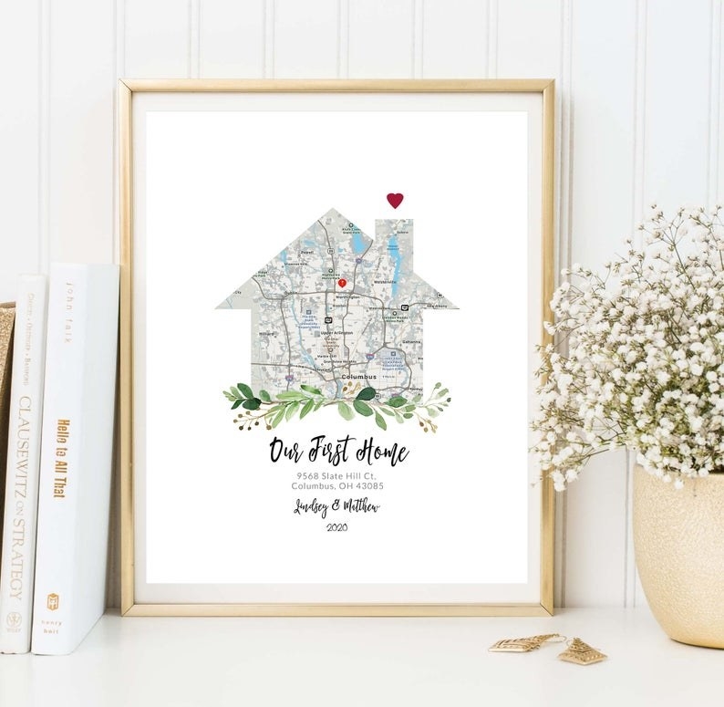 Framed Our First Home customized map in frame and placed against wall