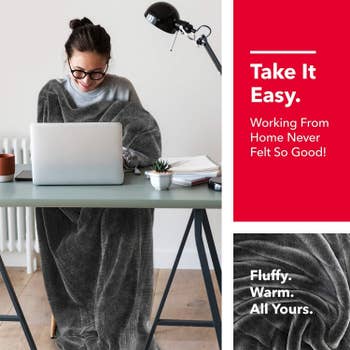 Model working on a laptop at a desk with the blanket draped over them